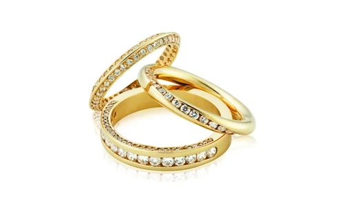 A radiant diamond eternity band showcasing a series of impeccably cut, round diamonds elegantly set in a continuous loop. 