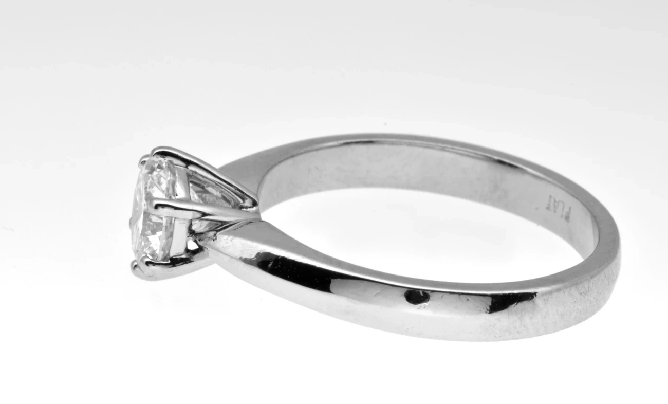 A stunning side view of a diamond solitaire ring featuring a delicate six-claw setting that elegantly secures a brilliant-cut diamond, showcasing the impeccable craftsmanship and timeless design by Aurum Fine Jewellery, Auckland NZ.