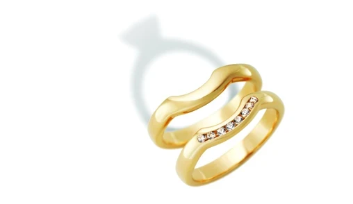 An elegant set of fitted wedding bands crafted from white gold, showcasing a seamless and snug fit designed for comfort and bespoke style. 