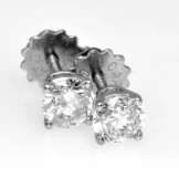 Four claw diamond studs total 0.75ct