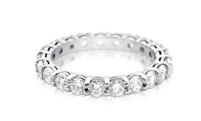 An exquisite full-diamond eternity ring featuring a continuous row of meticulously cut diamonds set in a sleek, polished band.