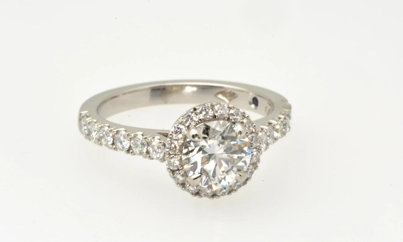 A stunning close-up of a diamond-encrusted bangle resting on a soft, dark velvet background. 