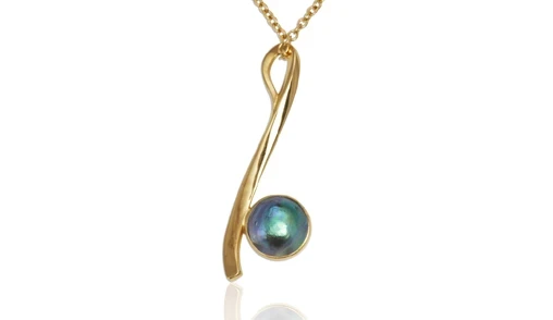 An exquisite Pacific blue pearl pendant featuring a lustrous, deep blue pearl set in a delicate silver setting, perfect for those seeking a blend of elegance and natural beauty.