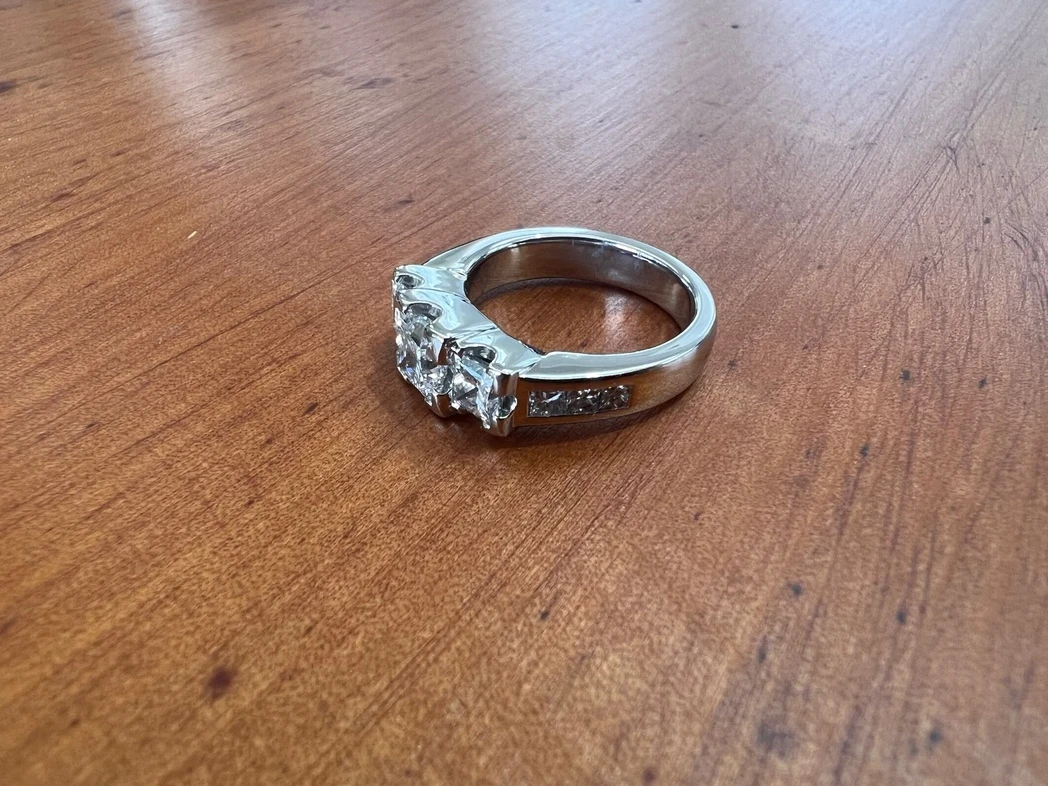 Plat three stone ring side view