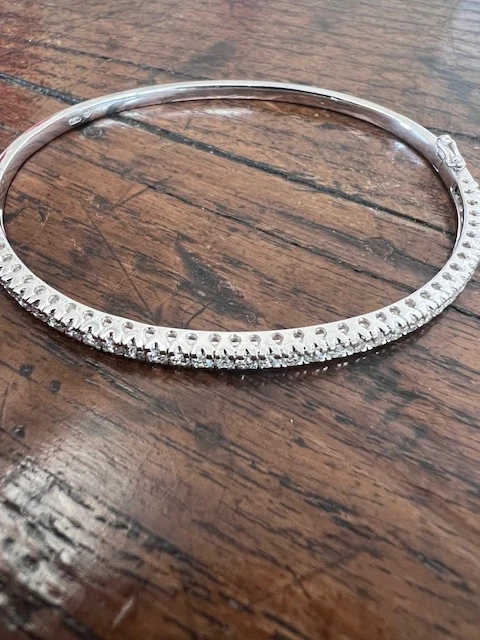 A stunning side view of a diamond snap bangle exquisitely designed with a blend of classic elegance and modern sophistication.